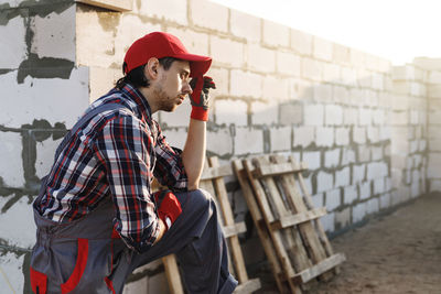 Side view of man using mobile phone