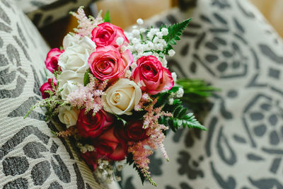 Close-up of rose bouquet on chair