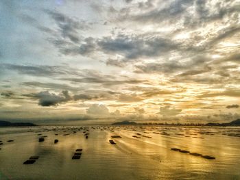 Scenic view of sea against cloudy sky