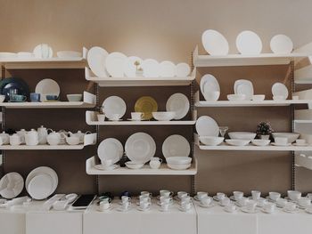 Crockery arranged on shelves