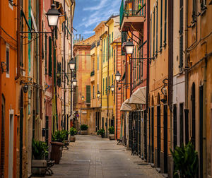 Alley amidst buildings in city of liguria