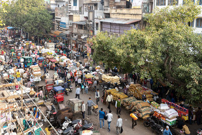 High angle view of people on street market