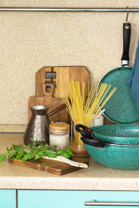 Potted plants on shelf at home