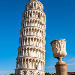 Low angle view of historical building against blue sky