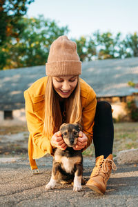 Full length of woman with dog