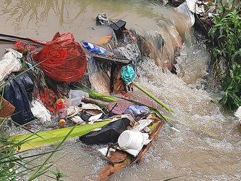 High angle view of garbage floating on river