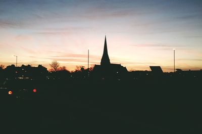 Silhouette of building at sunset