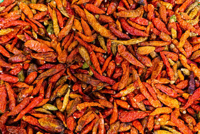 Full frame shot of red chili peppers at market