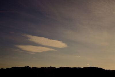 Silhouette of trees against sky at sunset