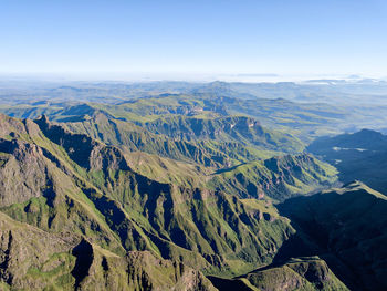 High angle view of dramatic landscape against clear sky