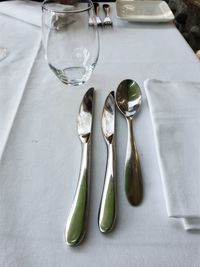 High angle view of cutlery on dining table