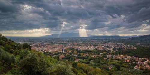 Crepuscular sunrays and the approaching storm. montecatini, tuscany, italy.