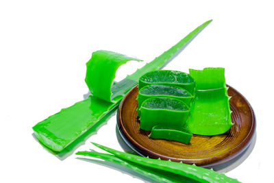 High angle view of green leaf on white background