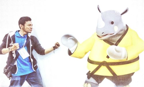 Full length of happy friends standing against white background