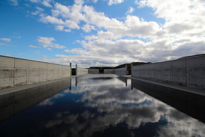 Bridge over river against sky