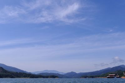 Scenic view of sea against blue sky