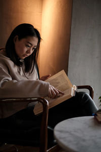 Young woman using laptop at home