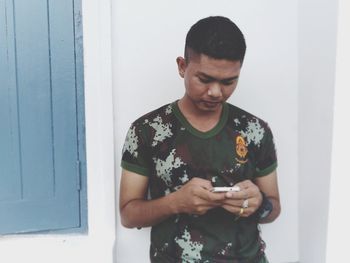 Young man using mobile phone