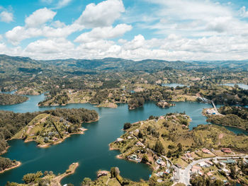 High angle view of sea and mountains against sky