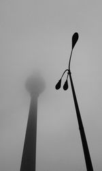 Low angle view of street light against sky