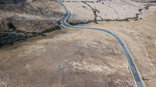 High angle view of tire tracks on road