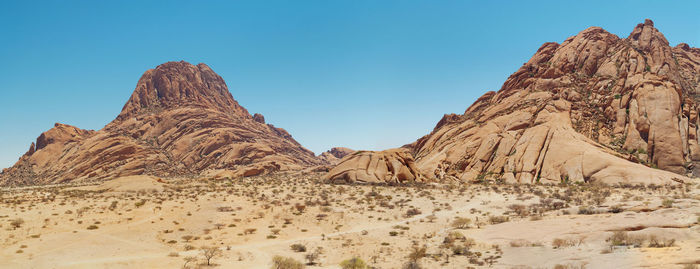 Panoramic view of rock formations against sky