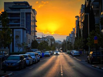 View of city street during sunset