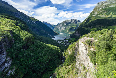 Scenic view of valley and mountains against sky