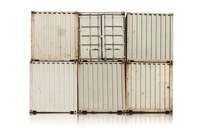 Metallic cargo containers against white background