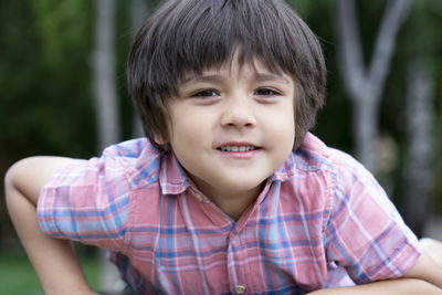 Portrait of smiling boy at park