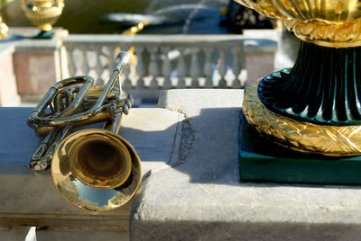 Close-up of musical equipment on retaining wall