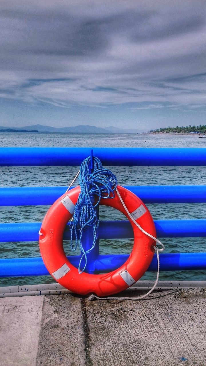 water, sea, blue, outdoors, no people, multi colored, tranquility, life belt, scenics, horizon over water, beauty in nature, close-up, nature, beach, day, sky