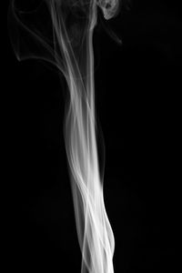 Close-up of smoke against black background