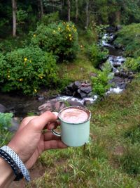 Man holding coffee cup