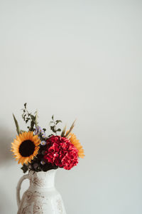 Close-up of flower vase against white background