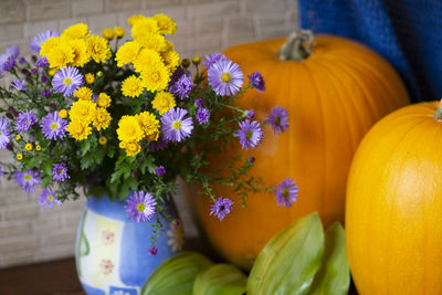 Close-up of yellow flowers on table
