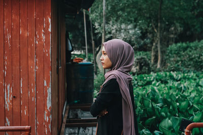 Side view of young woman looking away