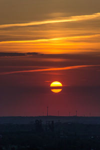 Scenic view of orange sky