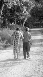 Rear view of man standing in park