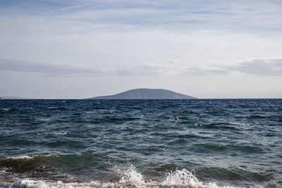 Small island on horizon