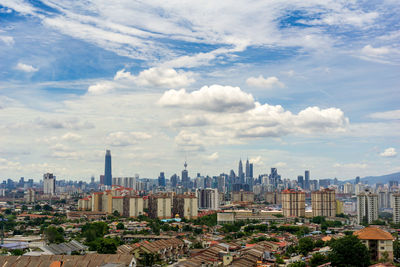 Modern buildings in city against sky