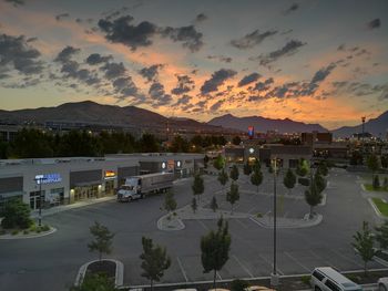 High angle view of city against sky during sunset