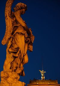 Low angle view of statue of liberty against clear sky