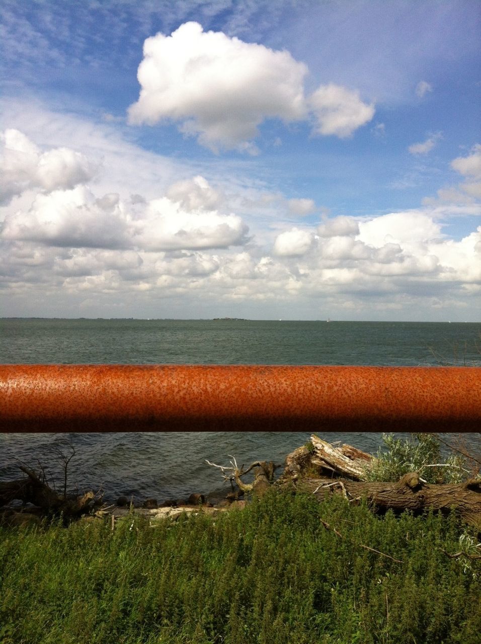 sky, water, cloud - sky, sea, cloud, tranquility, horizon over water, tranquil scene, scenics, nature, transportation, beauty in nature, cloudy, outdoors, blue, day, no people, grass, idyllic, shore