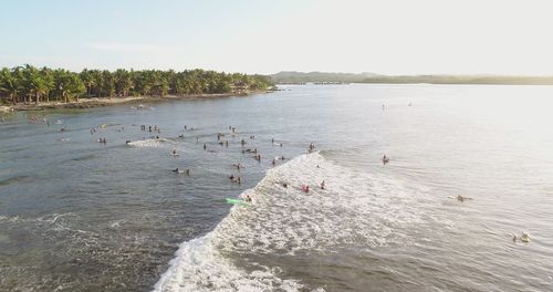 High angle view of sea shore against sky