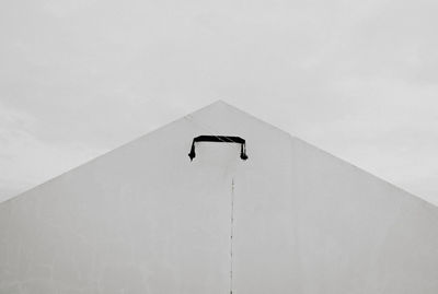 Low angle view of building against cloudy sky