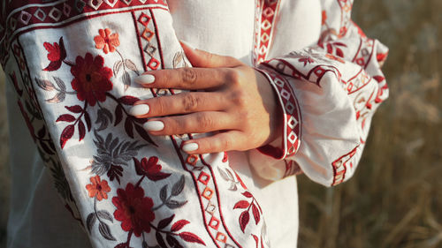 Midsection of woman holding gift