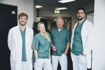 Portrait of multi-ethnic medical coworkers standing at hospital