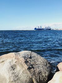 Scenic view of sea against clear blue sky