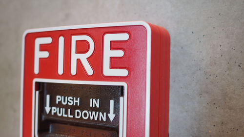 Close-up of warning sign on wall